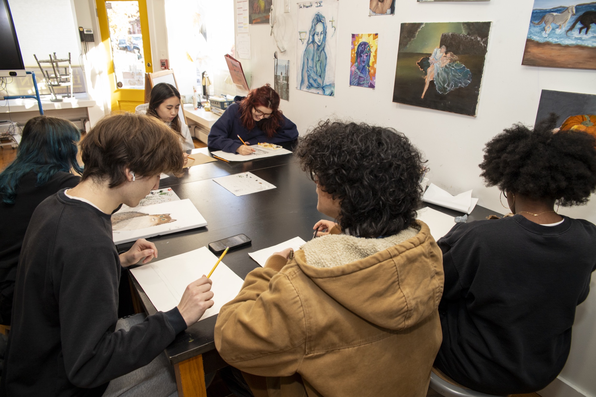 Small group of Upper School students collaborating in the art studio
