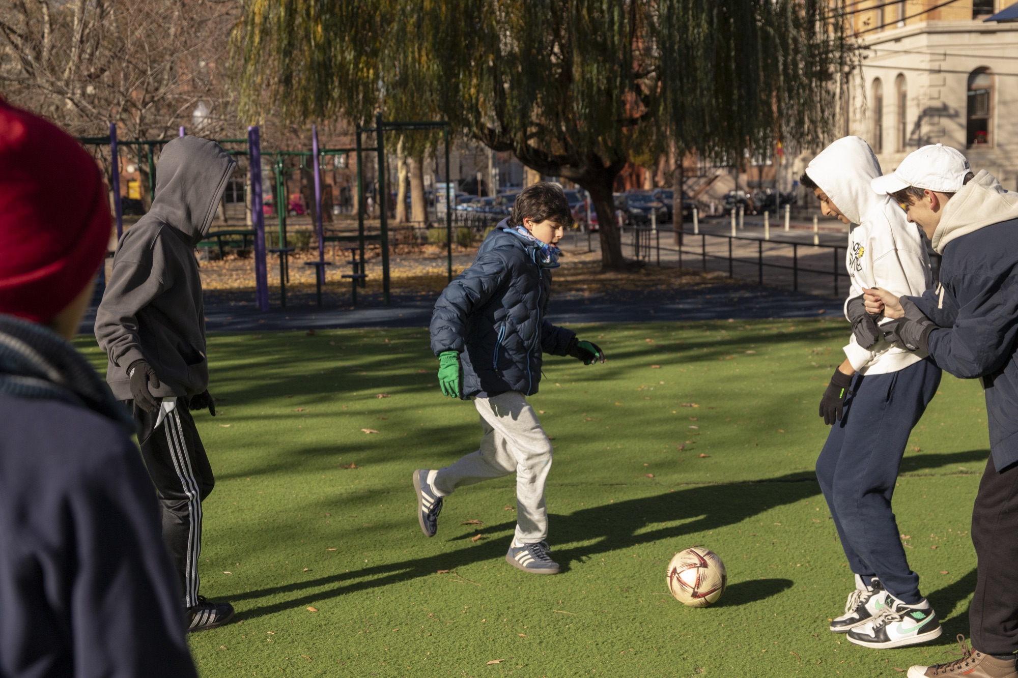 Group of Hudson School students competing in an outdoor soccer match