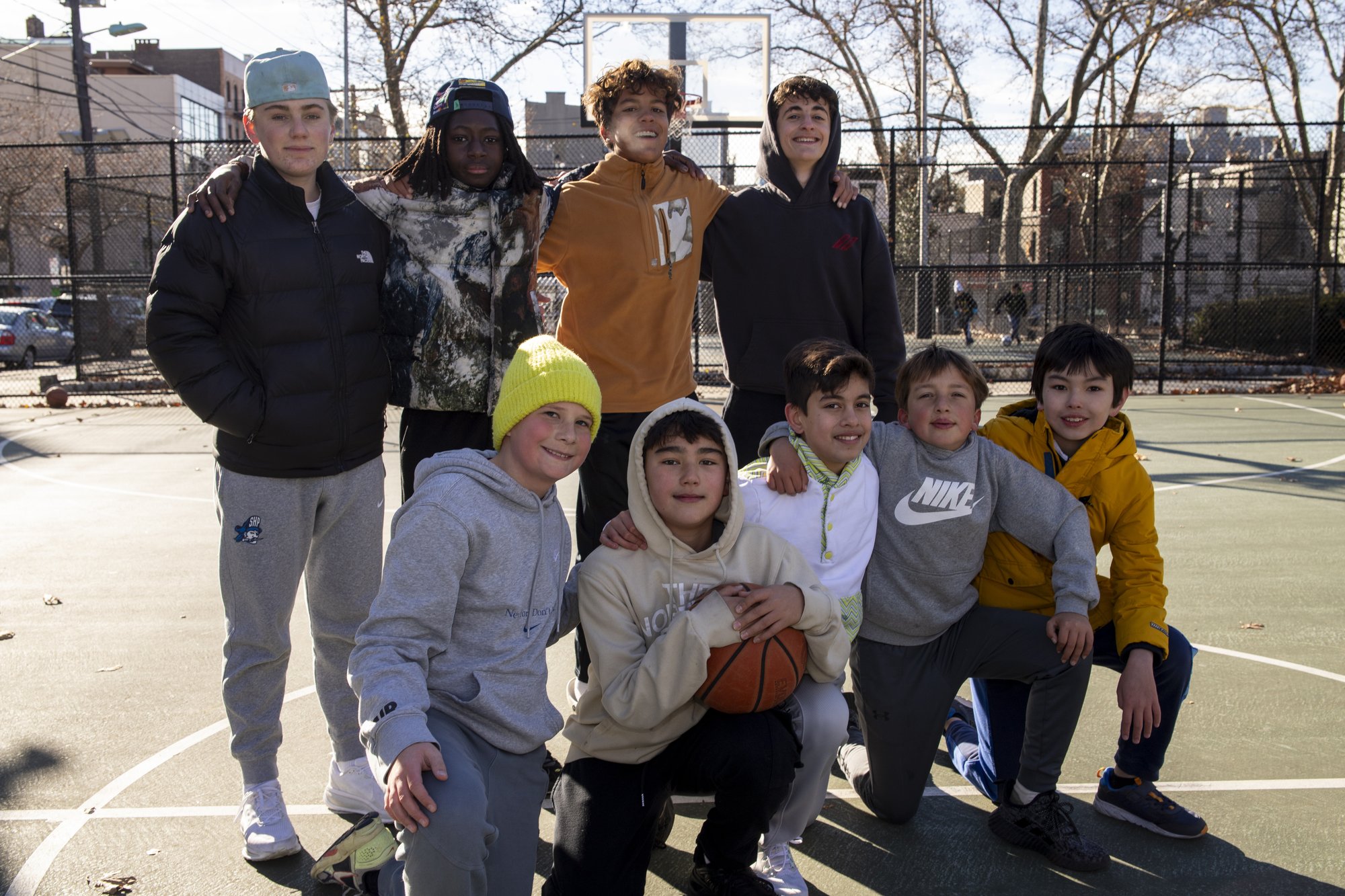 Young basketball players posing in team formation