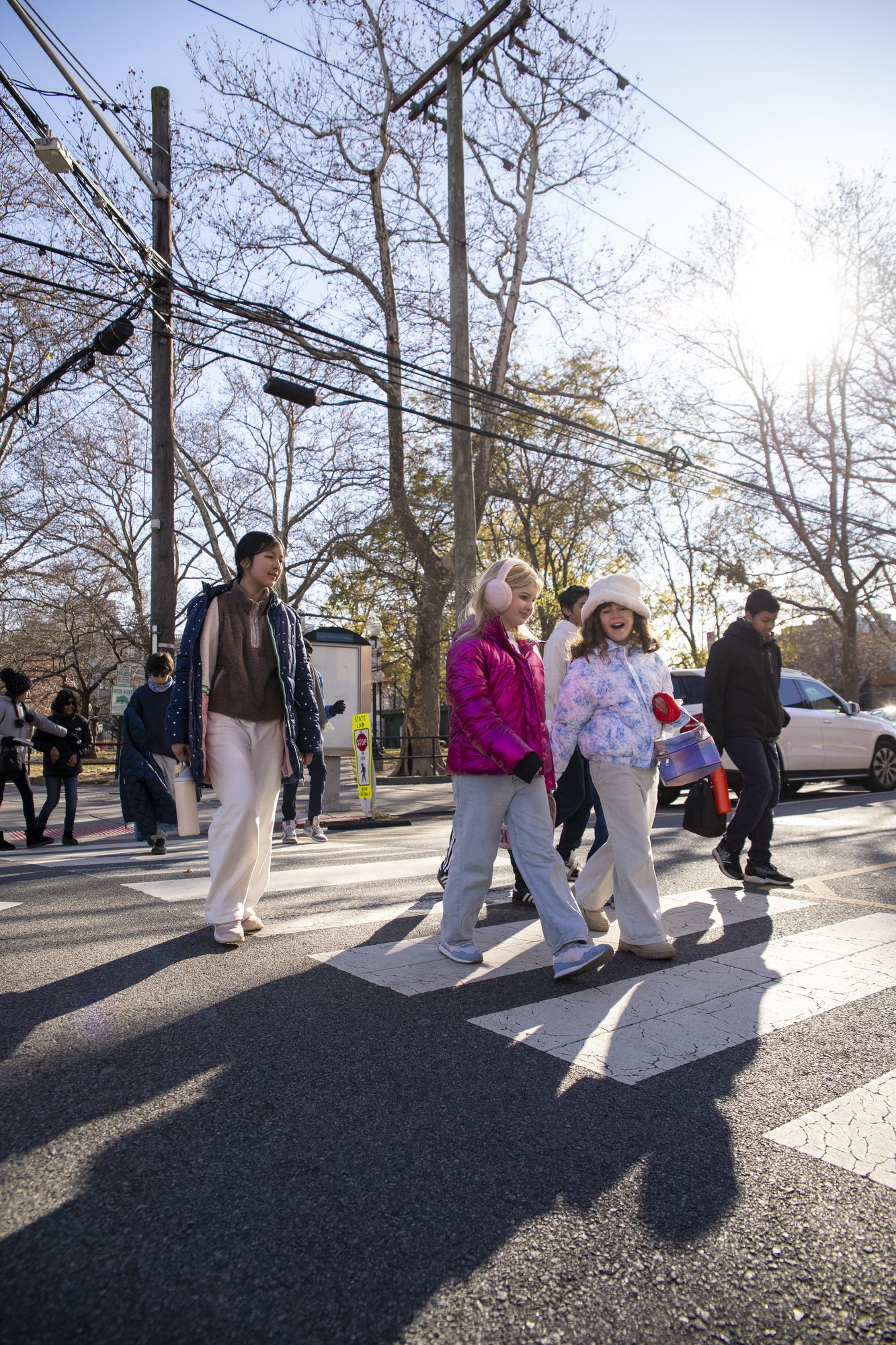 Students and parents arriving at school doorway