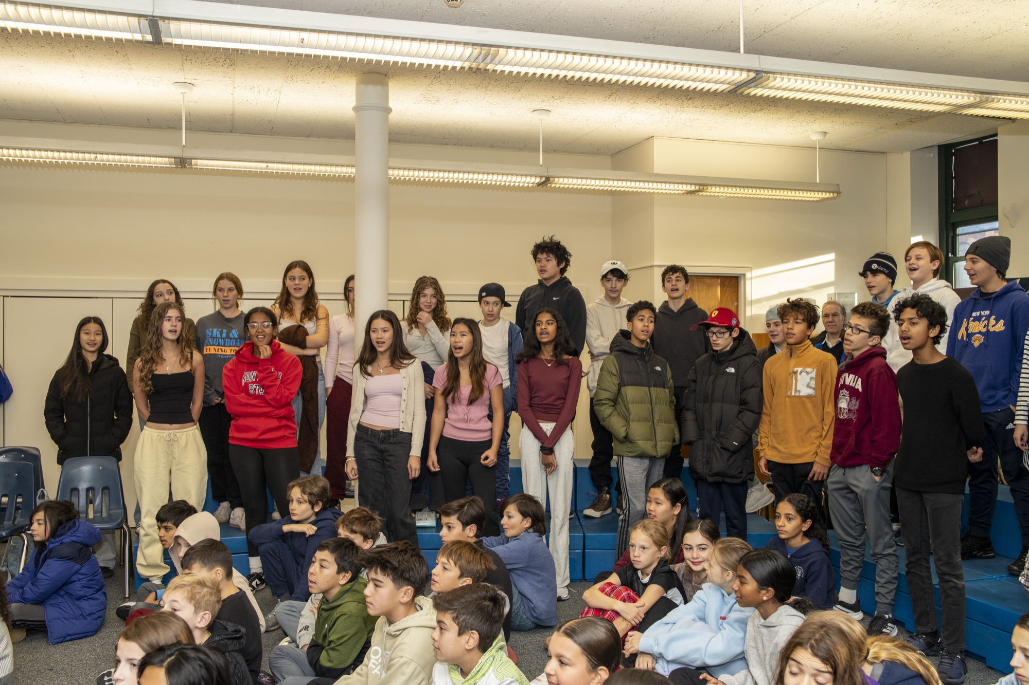 Hudson School students and families gathered together in the school auditorium