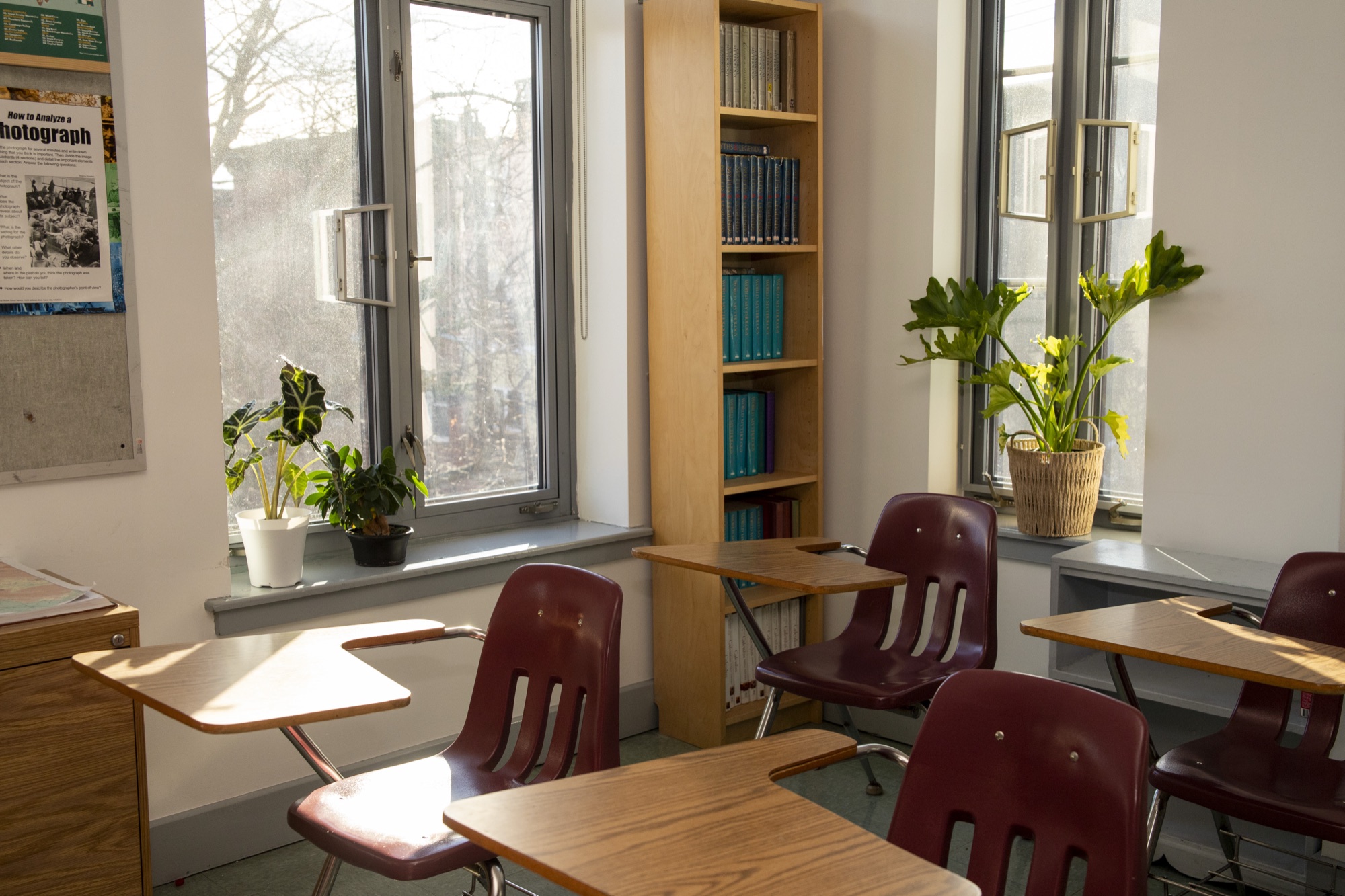 Hudson School student working at a desk in warm afternoon classroom light