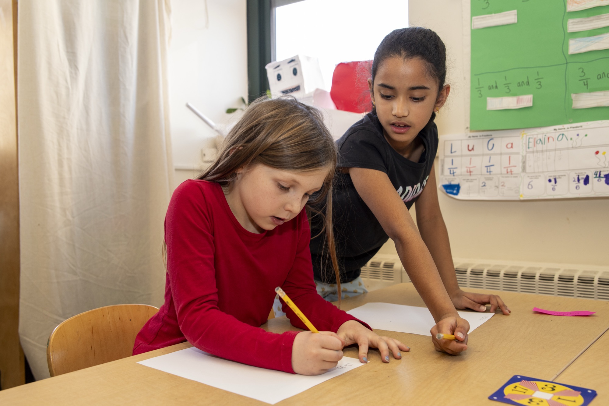 Middle School students collaborating in class