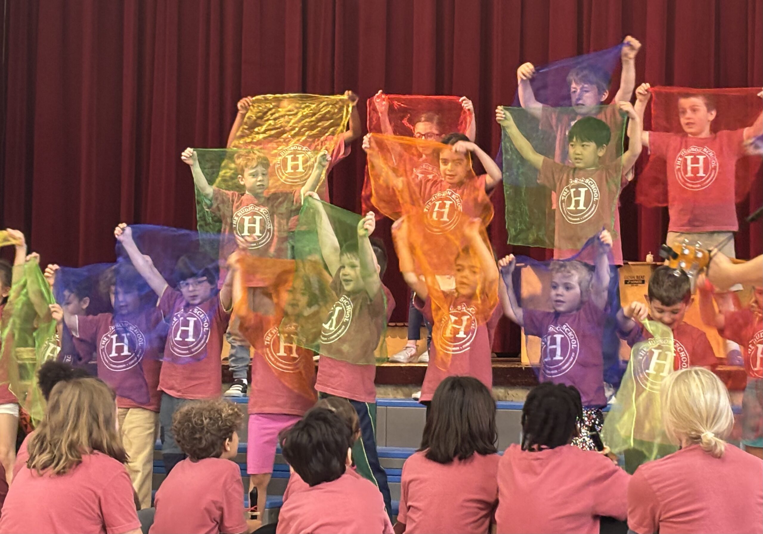 Young children playing with colorful scarves