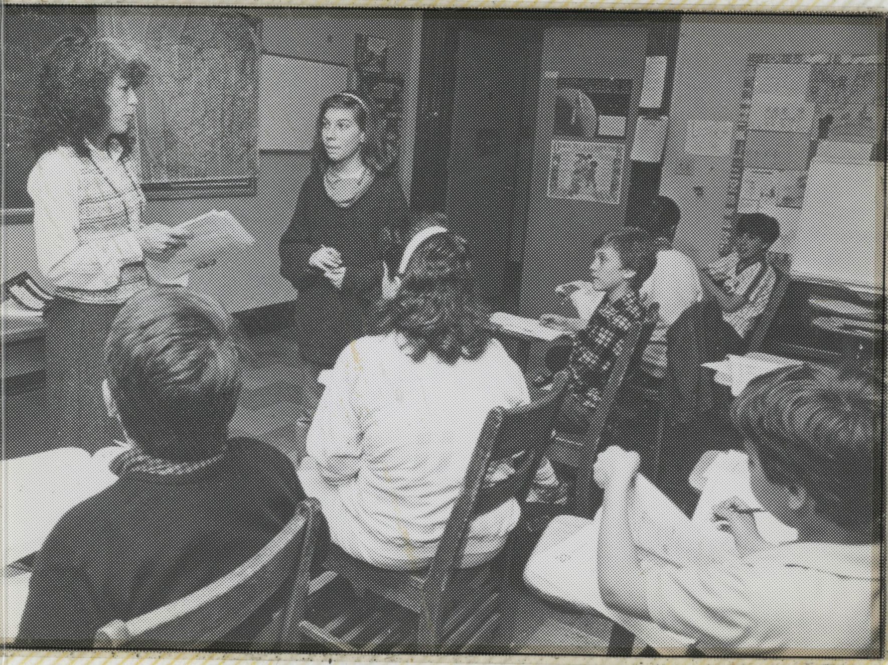 A Hudson School teacher leading a small seminar-style class discussion, in an archival photo.
